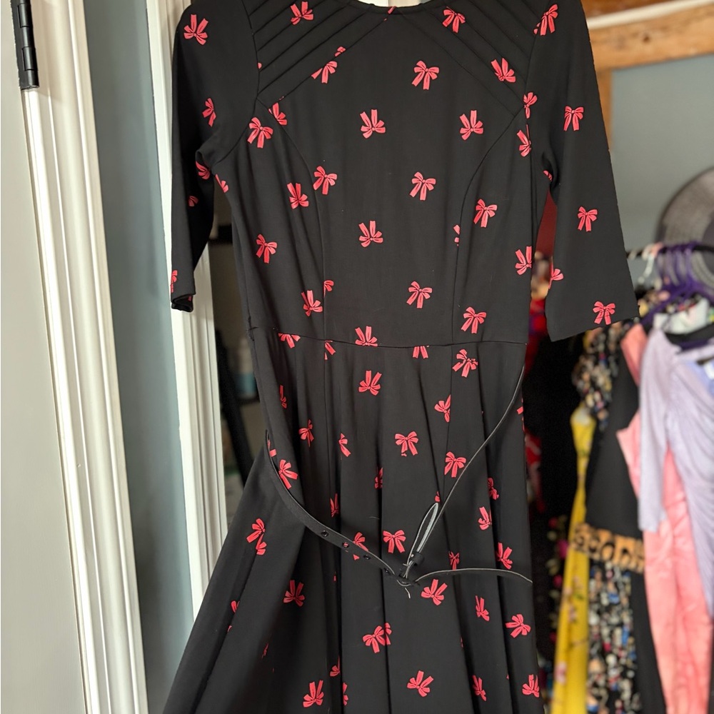 Unique Vintage Black Fit-and-Flare Dress with Pink Bow Print
